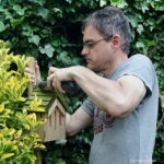 Intalling a butterfly house in the garden